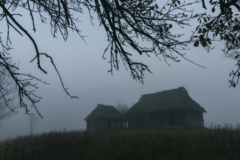 Landscape with alone old house on foggy meadow. Can be used like Halloween background. Located place: Carpathians, Europe Landscape with alone old house on foggy meadow. Can be used like Halloween background. Located place: Carpathians, Europe