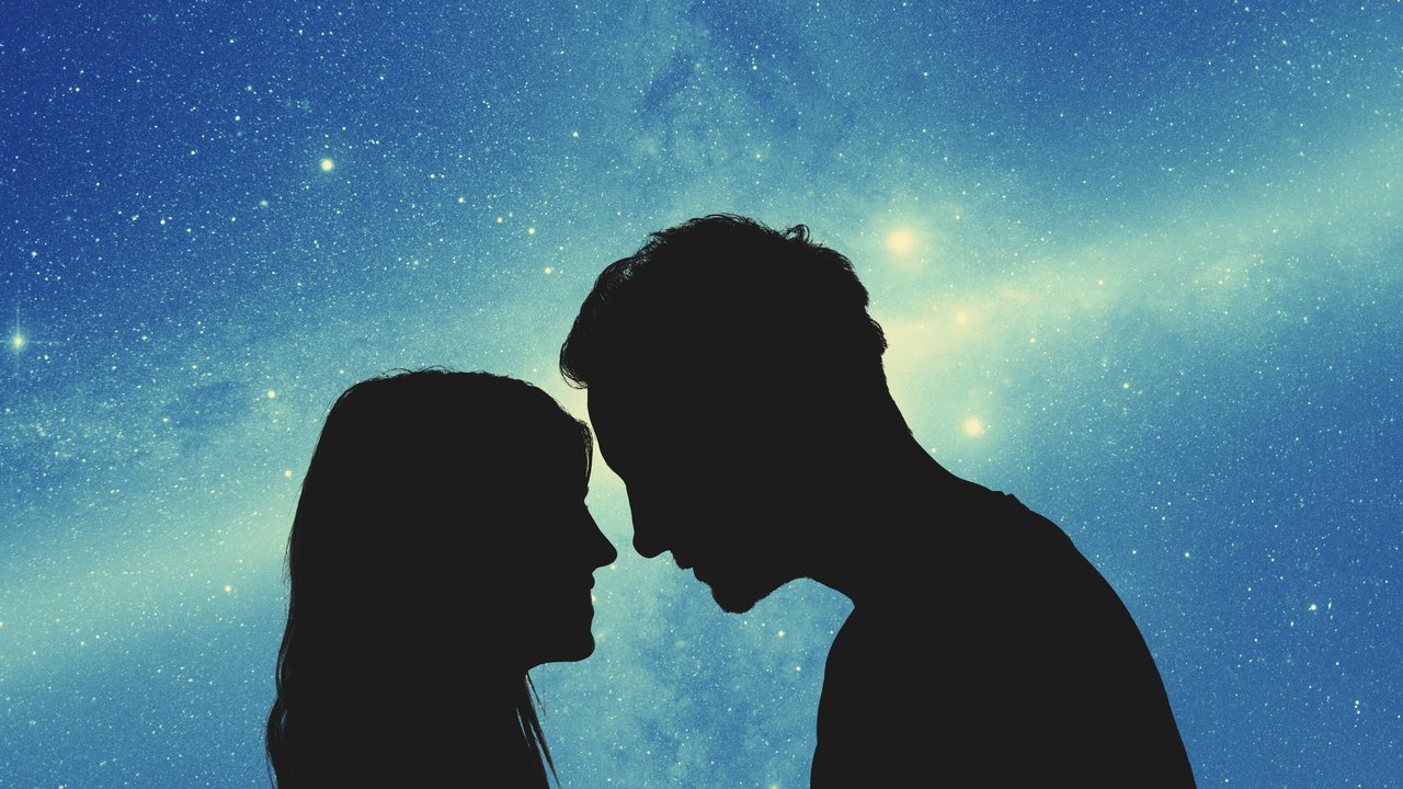 Silhouettes of a young couple under the starry sky. My astronomy work.