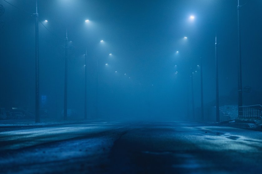 Foggy weather. Lanterns by the road. Night city Foggy weather. Lanterns by the road. Night city