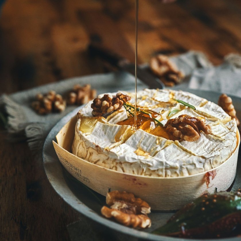 Baked Camembert Cheese Served with Honey and Fresh Figs Baked Camembert Cheese Served with Honey and Fresh Figs