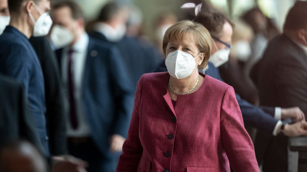 BERLIN, GERMANY - APRIL 21: German Chancellor Angela Merkel leaves after casting her votes after final debates on a series of new measures to rein in the coronavirus pandemic on April 21, 2021 in Berlin, Germany. The measures have met strong opposition because they expand the authority of the federal government over Germany's 16 states in imposing lockdown measures. Specifically, Chancellor Merkel's push to enable the federal government to impose nationwide nightly curfews has drawn the ire of critics. Germany is currently in the midst of its third wave of the pandemic, brought on by the B117 variant. (Photo by Maja Hitij/Getty Images)