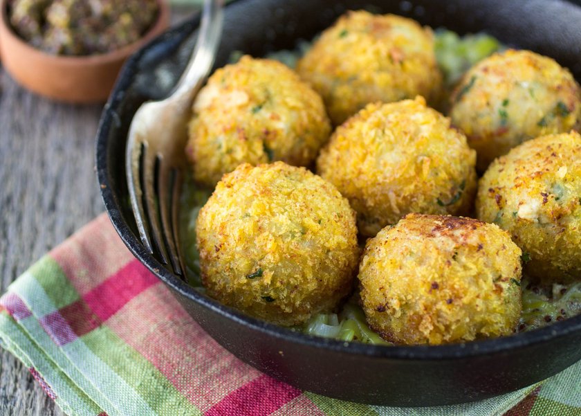 Homemade fish cakes with a sauce of leek. Soft focus