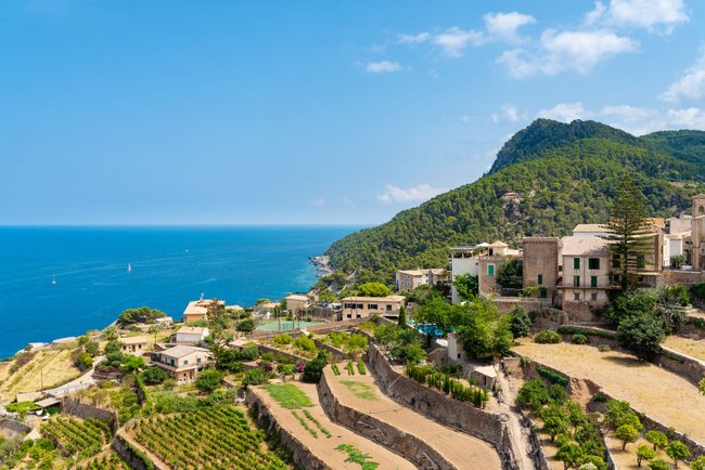 village of Banyalbufar on balearic island of Mallorca, Spain on beautiful summer day against blue sea and clear sky