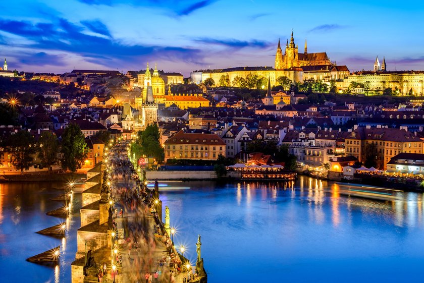 Prague, Czech Republic. Charles Bridge and Hradcany (Prague Castle) with St. Vitus Cathedral and St. George church evening dusk, Bohemia landmark in Praha.