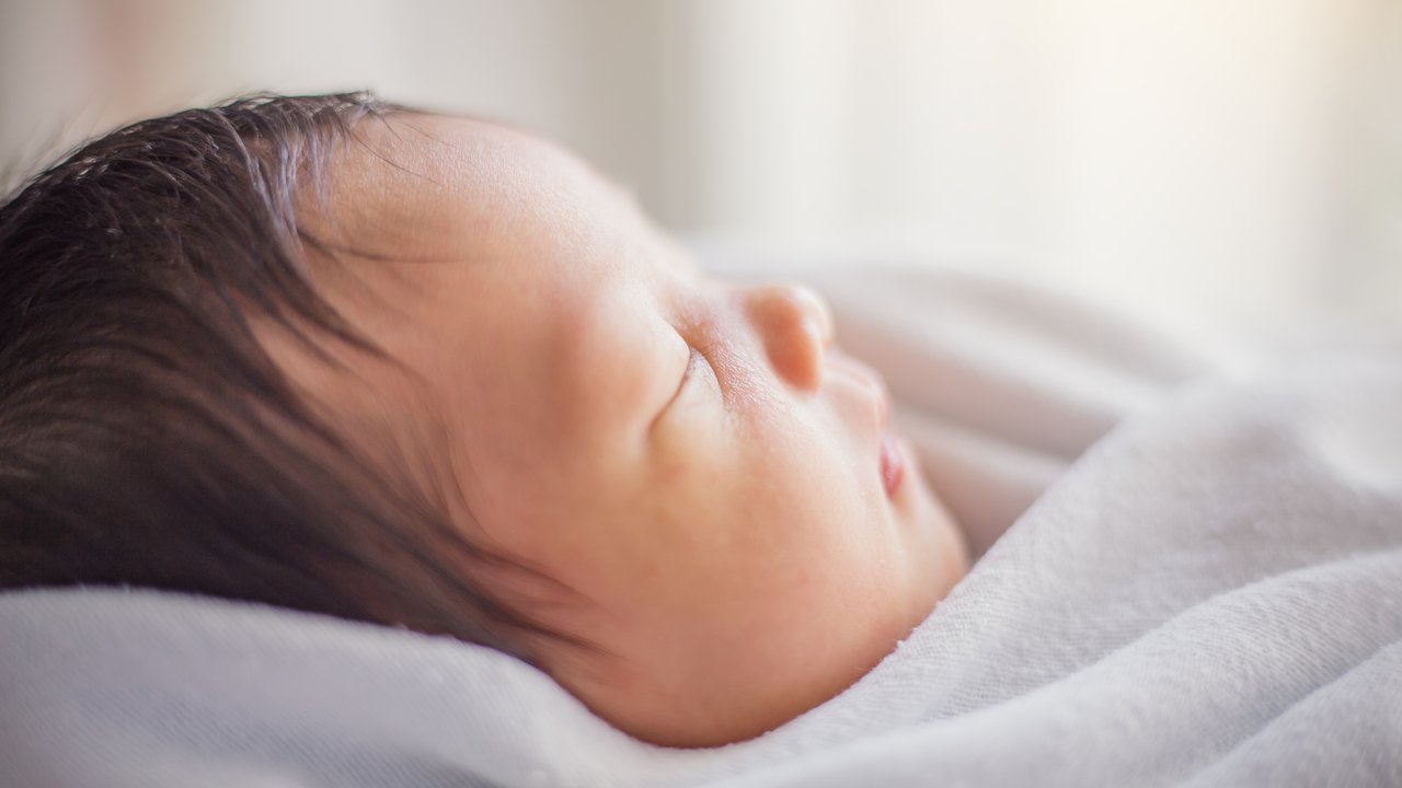 Closeup portrait of asian newborn baby asleep, vintage color