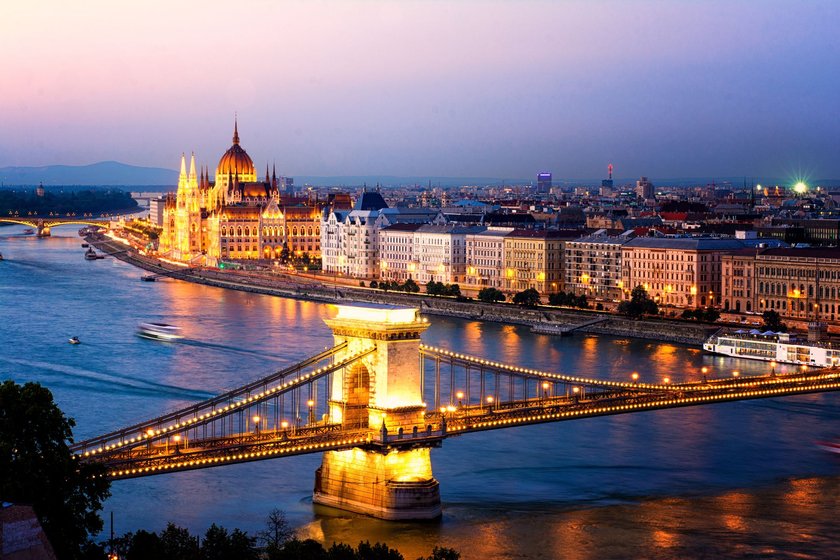 The Hungarian Parliament and the Chains Bridge in Budapest at sunset.