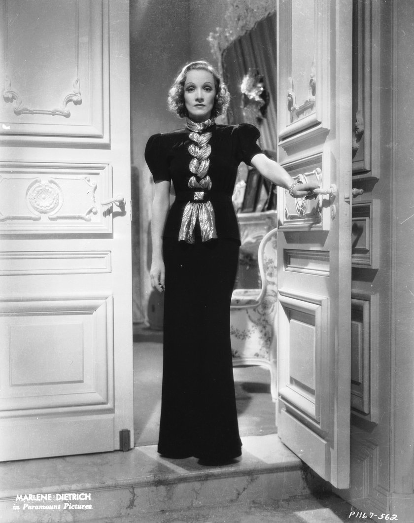 1937:  Marlene Dietrich (1901 - 1992) in a scene from the romantic drama 'Angel', directed by Ernst Lubitsch for Paramount with costume designs by Travis Banton.  (Photo via John Kobal Foundation/Getty Images)