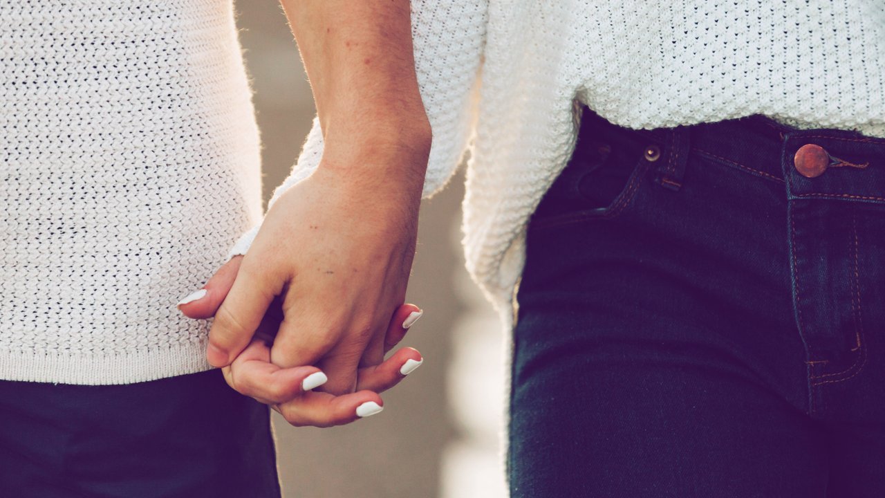 Crop hands of couple in casual wear and white manicure Copyright: xAlexandraxCoelhox