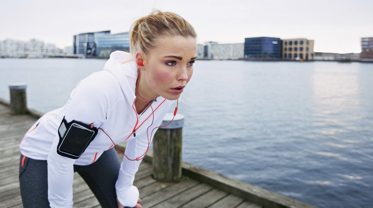 Woman taking a break while running Woman taking a break while running