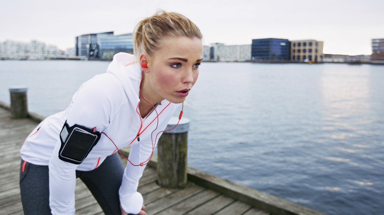 Woman taking a break while running Woman taking a break while running