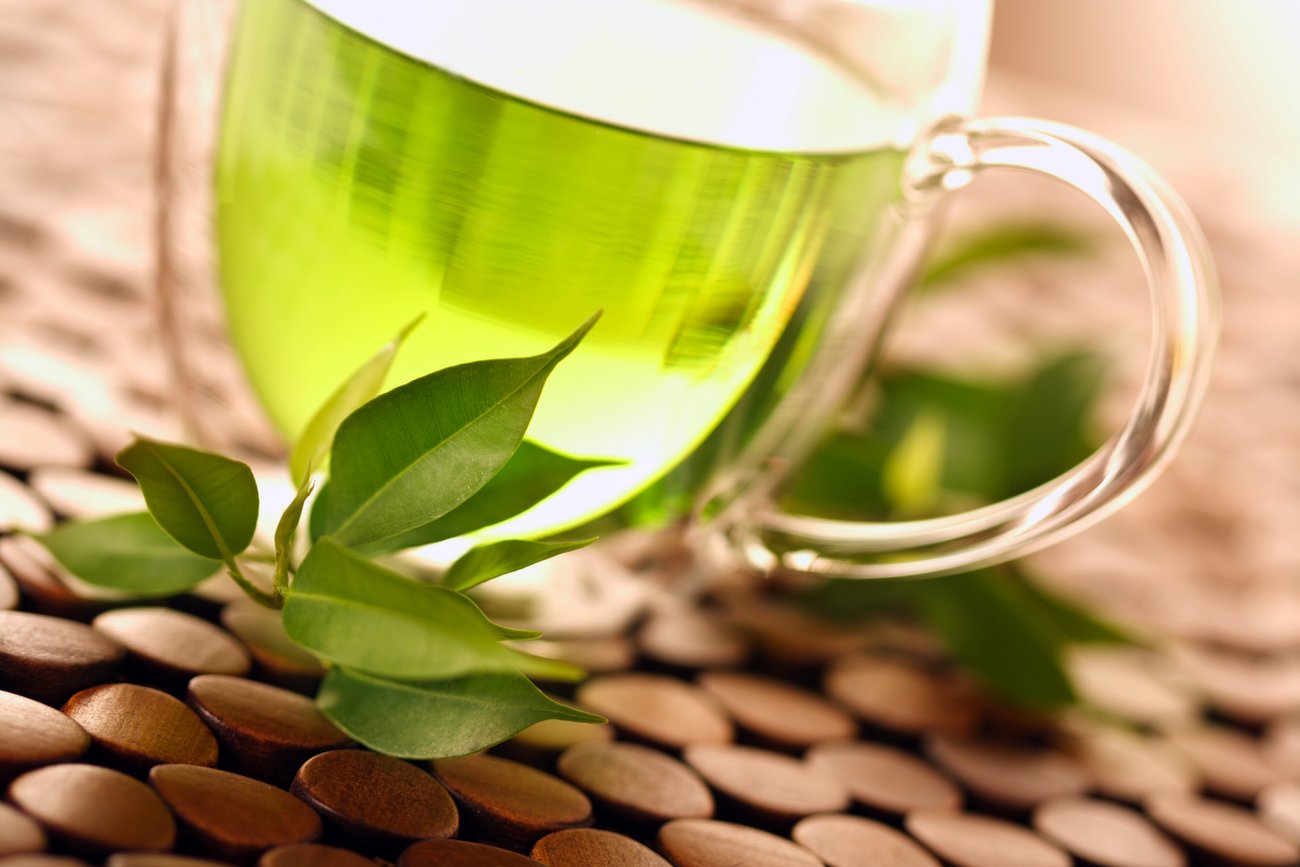 healthy green tea cup with tea leaves healthy green tea cup with tea leaves