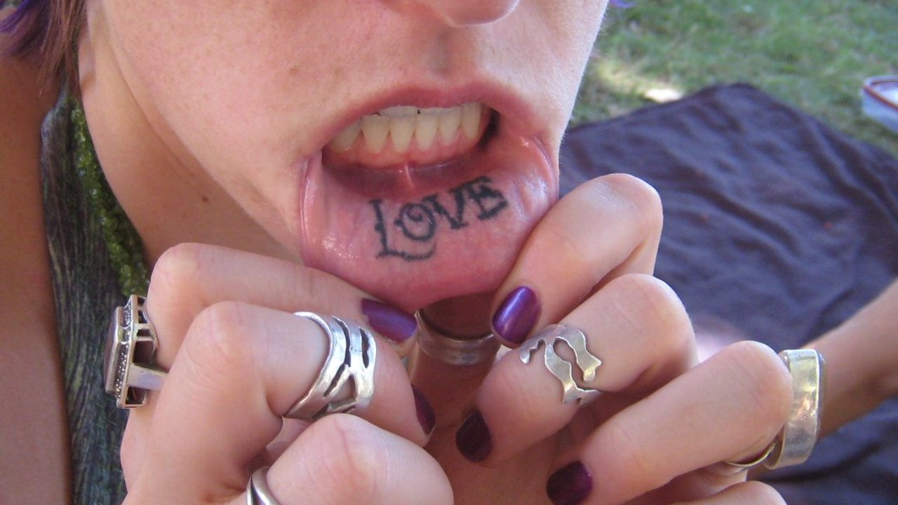 Girly cute lip tattoos