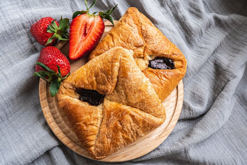 Kolashen from Austrian puff pastry with berry-strawberry filling, with strawberry jam. Bohemian kolashen, Copenhagen pastries, Viennese bread. View from above
