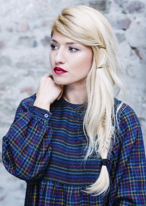 Young beautiful woman against old stone wall, outdoor shot Young beautiful woman against old stone wall, outdoor shot