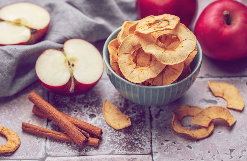 Dried apple chips. Dehydrated apples. Homemade dried organic apple sliced.