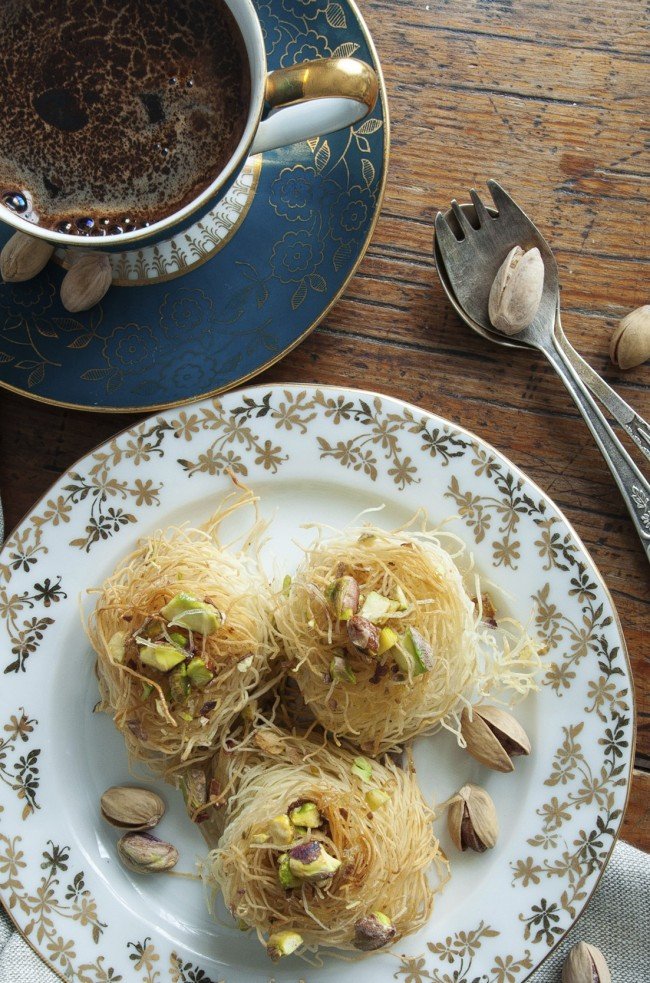 Traditional Middle Eastern dessert baklava with pistachio nuts and Vintage Porcelain Czech Republic Coffee Cup