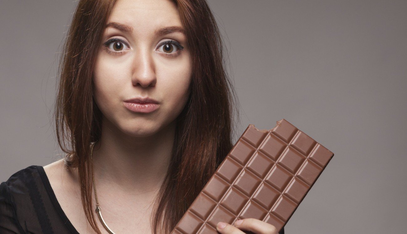 Portrait of the young girl with  big chocolate