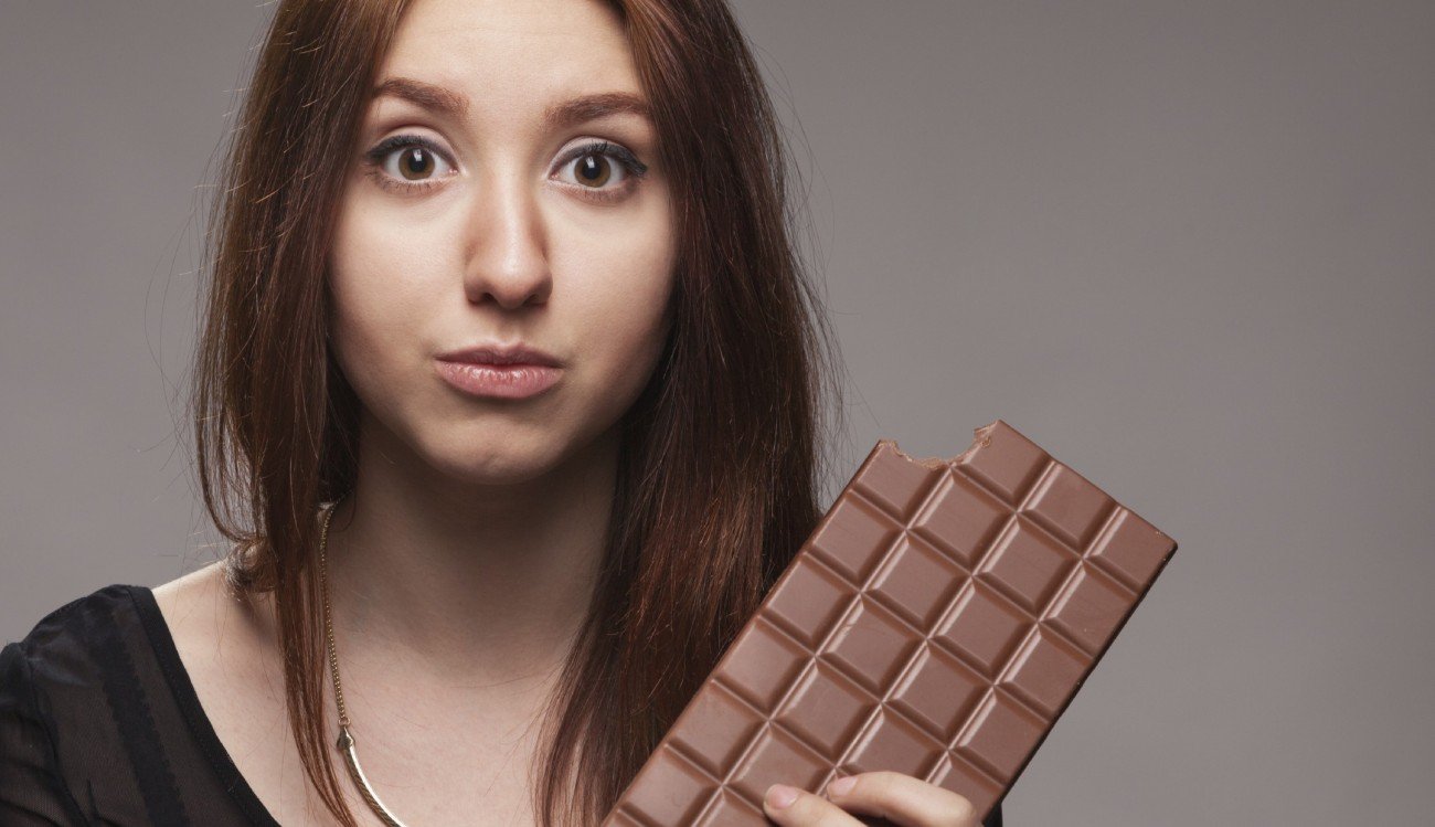 Portrait of the young girl with big chocolate Portrait of the young girl with big chocolate