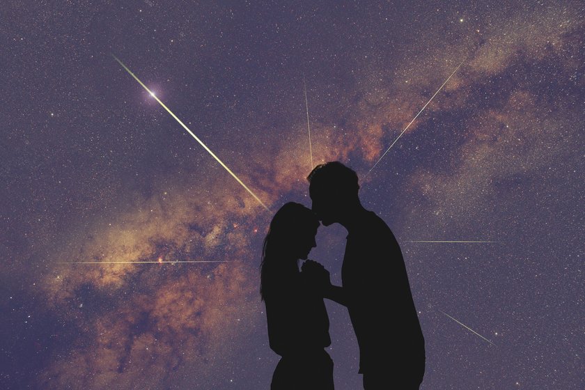 Silhouettes of a young couple under the starry sky. My astronomy work.