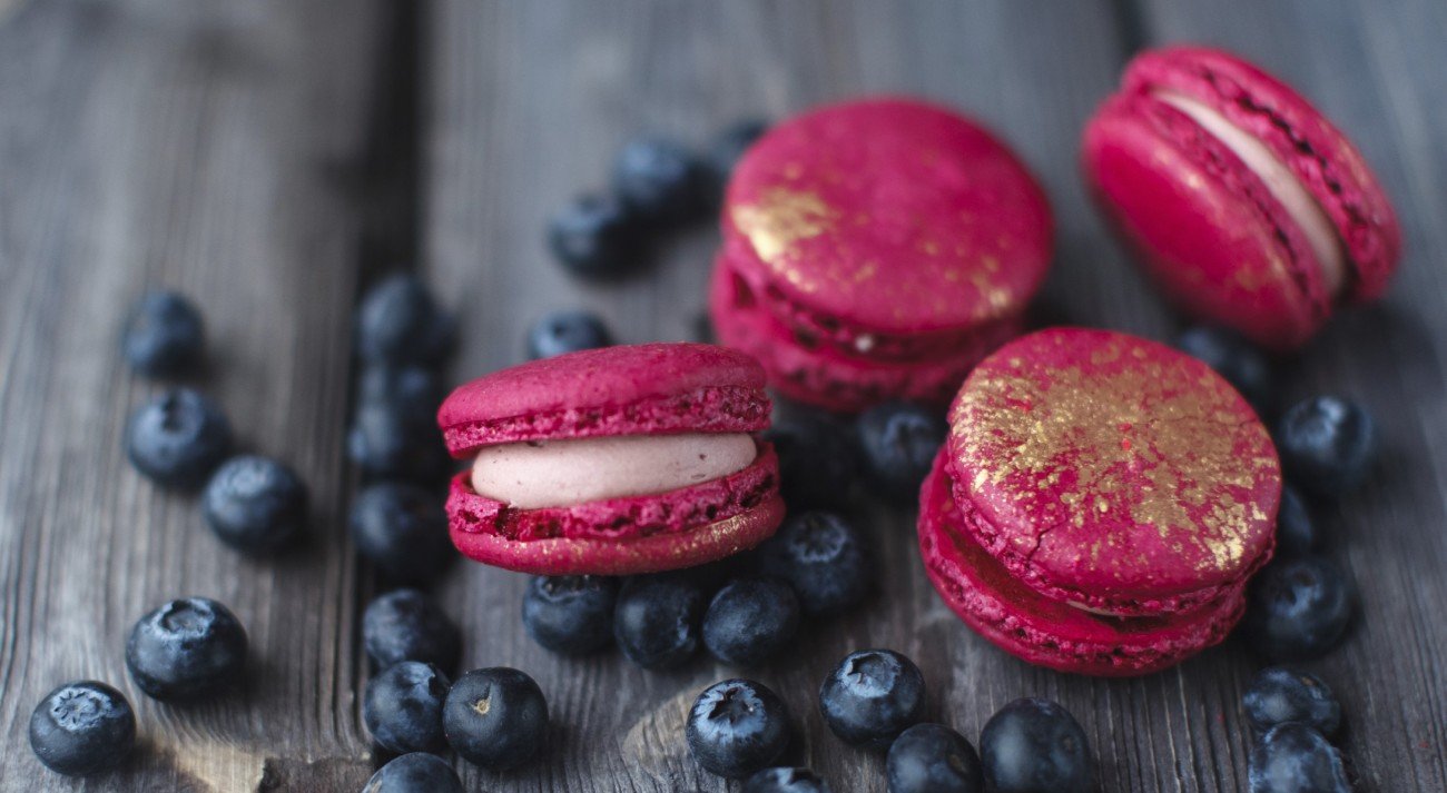fresh macaroons and ripe blackberry on a wooden background fresh macaroons and ripe blackberry on a wooden background