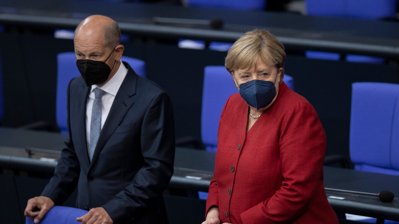 BERLIN, GERMANY - AUGUST 25: German Chancellor Angela Merkel and Finance Minister and Vice Chancellor Olaf Scholz arrive at the Bundestag, Germany's parliament, to debate about the current situation in Afghanistan on August 25, 2021 in Berlin, Germany. Germany is among nations evacuating citizens and endangered Afghans from Kabul following the recent Taliban takeover. So far the Bundeswehr, Germany's armed forces, have flown out over 3,600 people. (Photo by Maja Hitij/Getty Images)