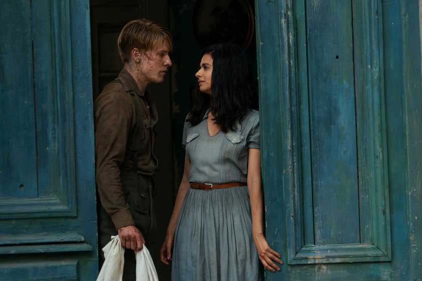All the Light We Cannot See. Louis Hofmann as Werner Pfennig, Aria Mia Loberti as Marie-Laure