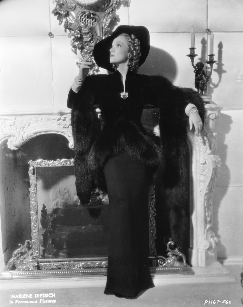 1937:  Marlene Dietrich (1901 - 1992) in a scene from the romantic drama 'Angel', directed by Ernst Lubitsch for Paramount with costume designs by Travis Banton.  (Photo via John Kobal Foundation/Getty Images)