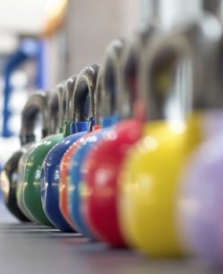 colorful kettlebell lining on table colorful kettlebell lining on table