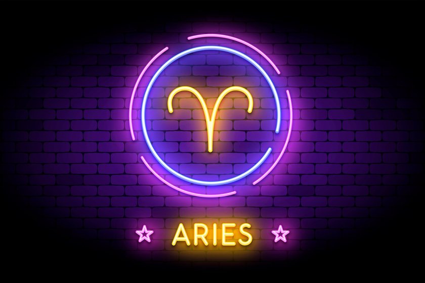 The Aries zodiac symbol, horoscope sign in trendy neon style on a wall. Aries astrology sign with light effects for web or print.