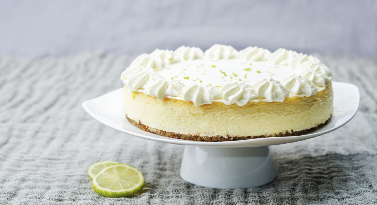 lime cheesecake on a white wood background. toning. selective focus