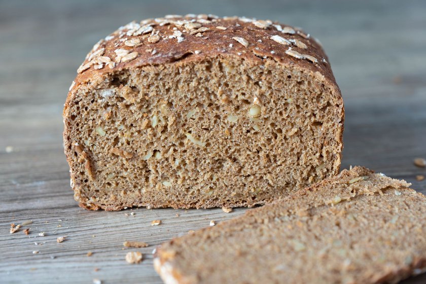 Sliced wholemeal bread on a wooden table