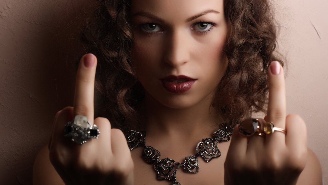 Beautiful woman showing middle fingers