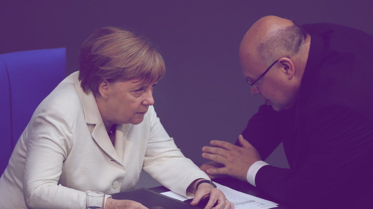 BERLIN, GERMANY - JUNE 28:  German Chancellor Angela Merkel speaks with Minister of the Chancellery Peter Altmeier after she addressed the Bundestag with a government declaration on the recent Brexit vote on June 28, 2016 in Berlin, Germany. European leaders are scheduled to meet at a summit in Brussels later today to discuss the consequences of the British vote to leave the European Union. Merkel called the vote an unprecedented event in EU history but one the remaining 27 member states will weather.  (Photo by Sean Gallup/Getty Images)