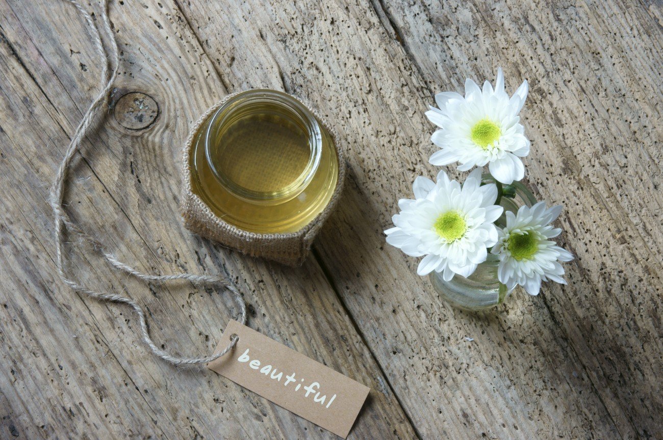Coconut oil, essential oil from nature, a skin care that safe, rich vintamin, use in massage at spa, organic cosmetic on wooden background Coconut oil, essential oil from nature, a skin care that safe, rich vintamin, use in massage at spa, organic cosmetic on wooden background