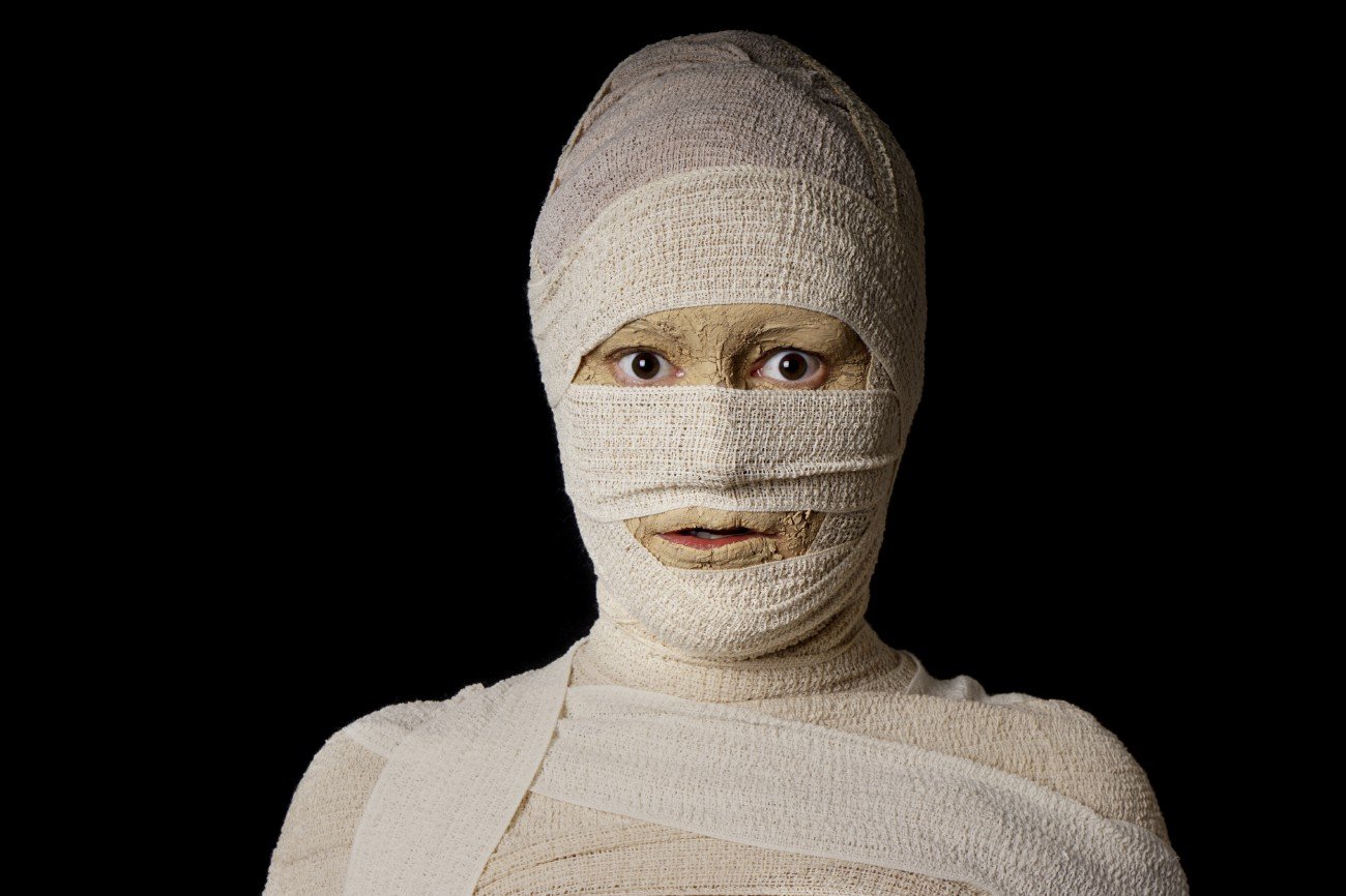 woman wrapped up with bandages as an egyptian mummy for halloween